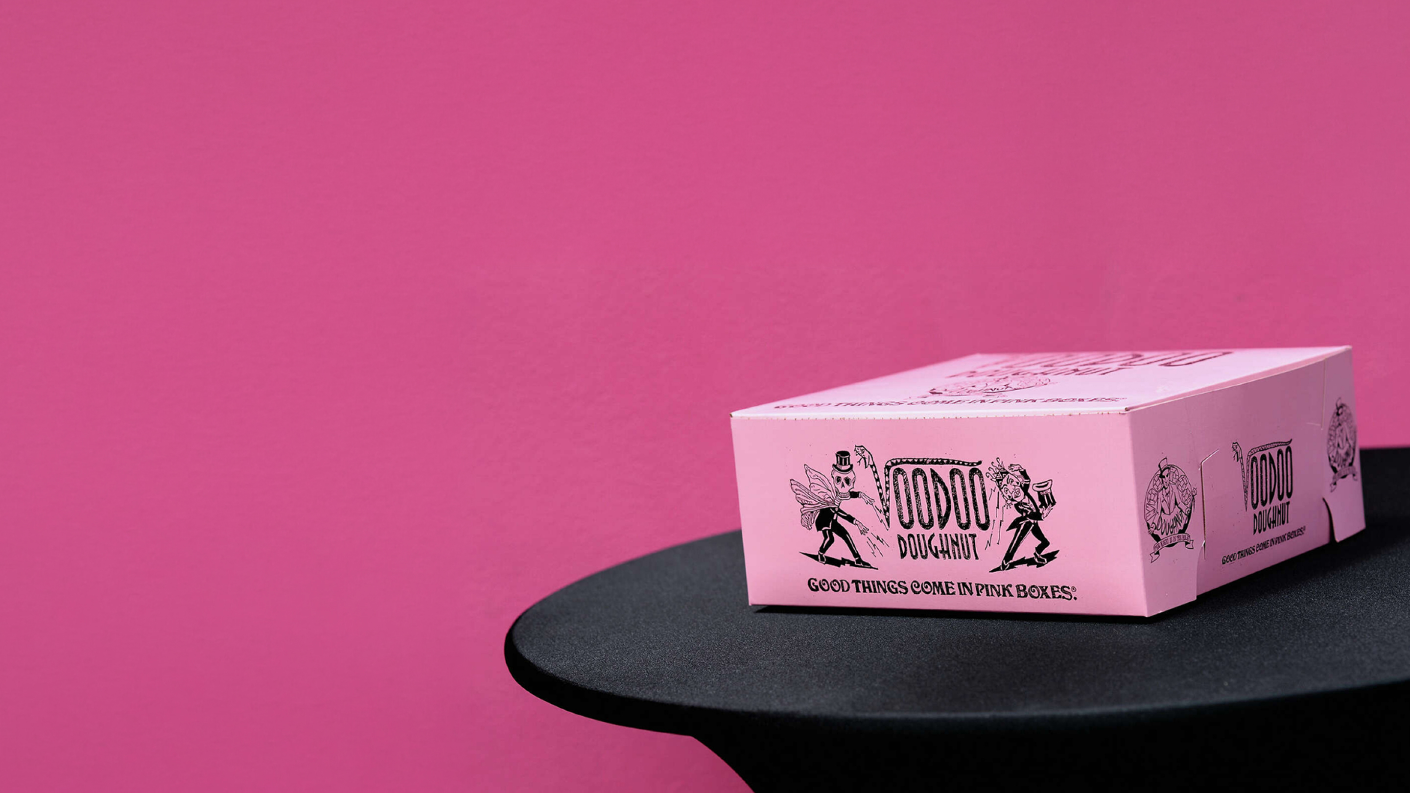 Voodoo Doughnut box on dark table